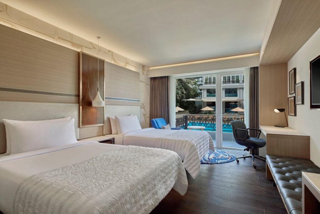 Classic- 2 queen-balcony-Pool view